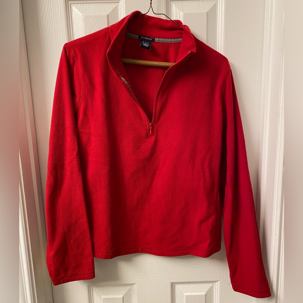 Thin, red fleece. Stretchy.